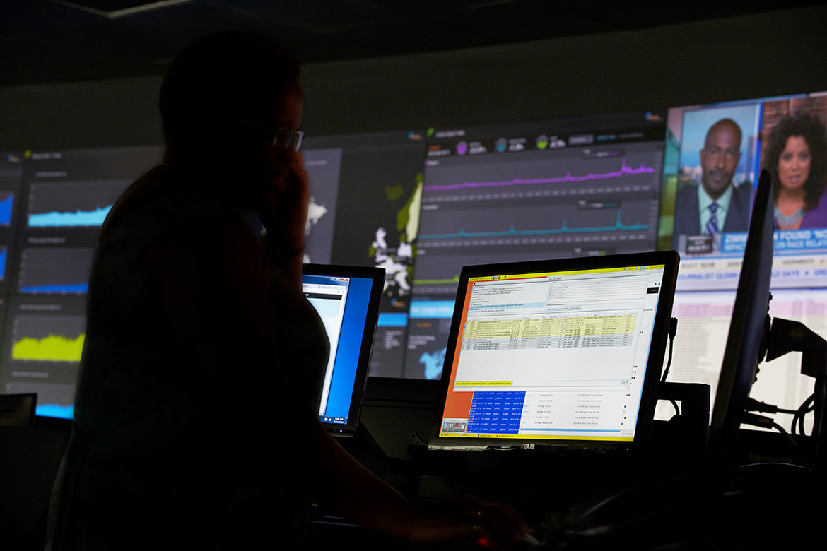 TV control room with worker at computer